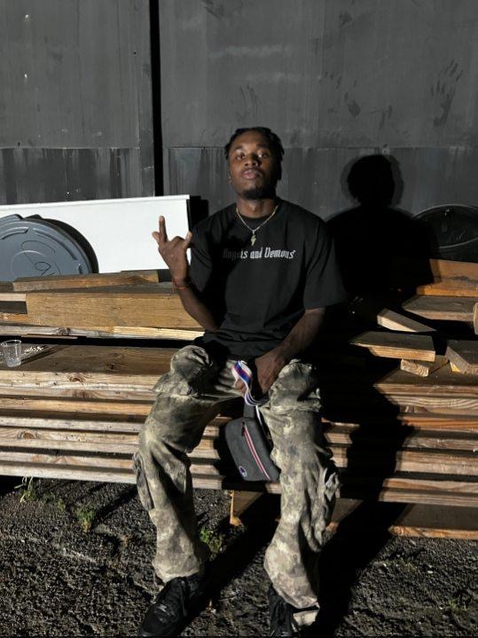 baby gap posing like a boss who makes music