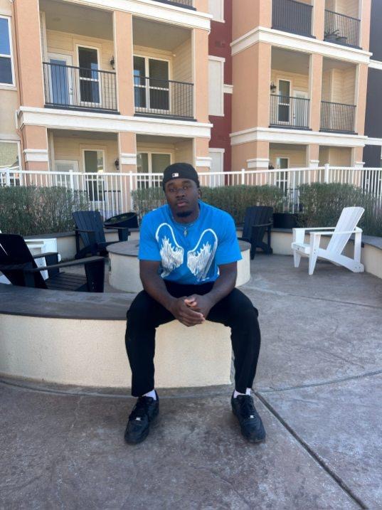 Baby Gap sitting on a bench repping Angels and Demon